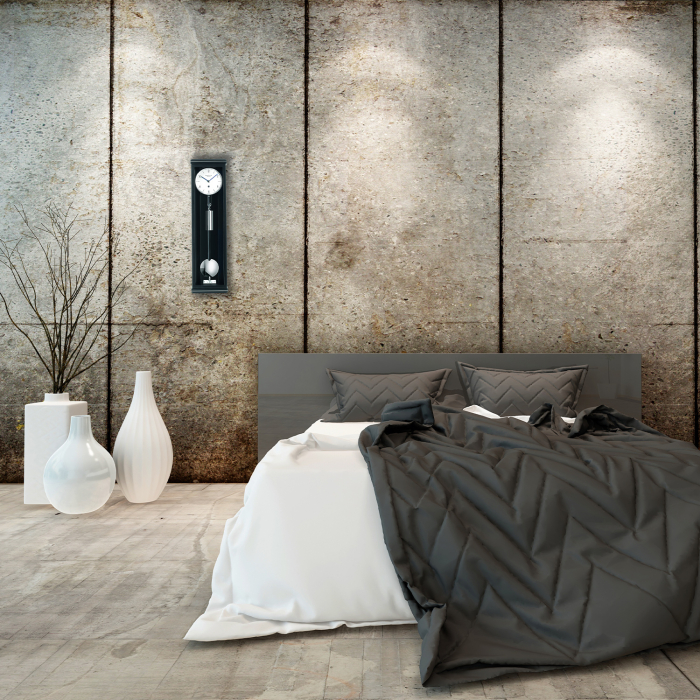 Design-Schlafzimmer mit Wanduhr Classica S 60 M von Erwin Sattler an Betonwand