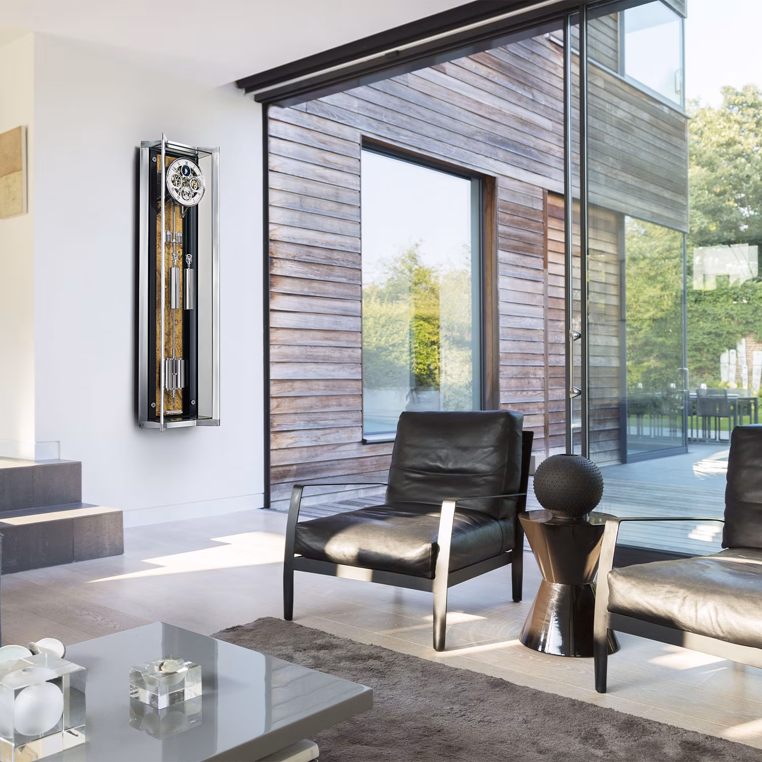 Erwin Sattler Opus Perpetual mounted on the wall with a back panel made of light olive wood